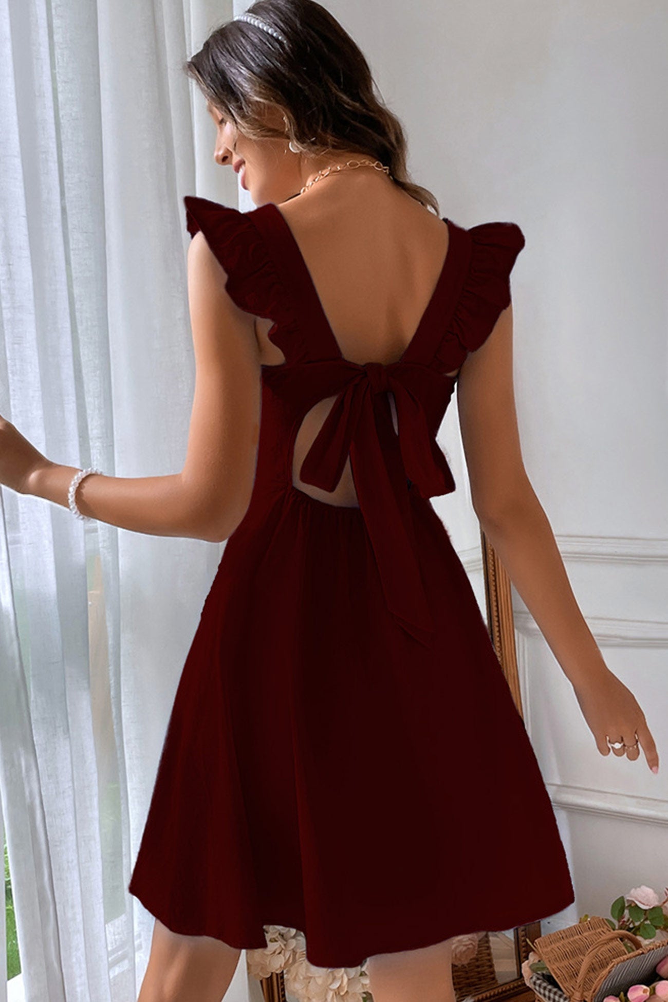 Ruffle Sleeveless Tie-back Mini Dress